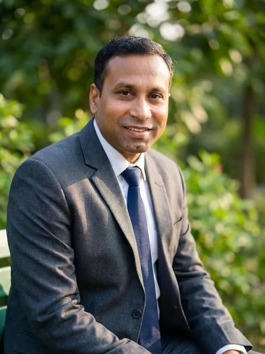 Founder of LEAFFLIX Nursery, seated in a green garden
